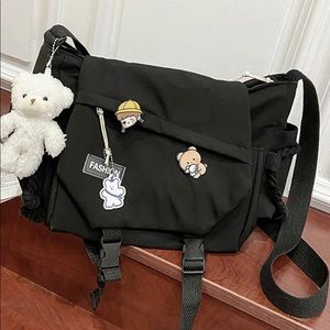 Black crossbody bag with accessories